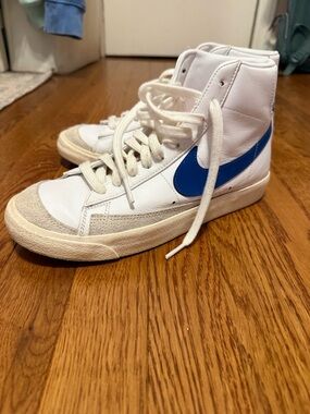 Nike White High-Top Sneakers with Blue Swoosh